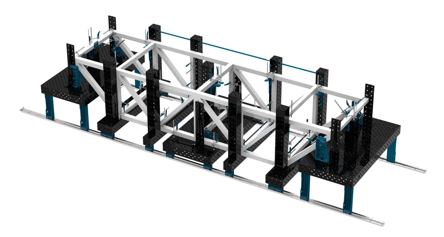 Construction de charpente spatiale sur supports et tables de soudage montées sur le système de rails SLIDE SYSTEM